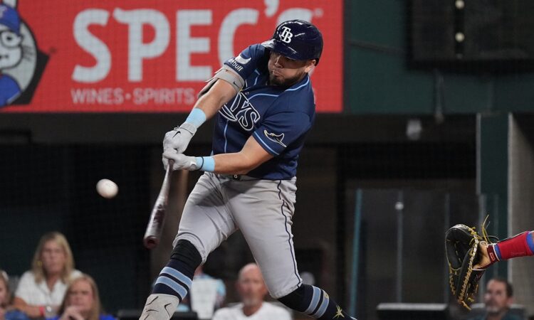 Tampa Bay Rays first baseman Jonathan Aranda, No. 8, drives a pitch with the ball off the barrel.