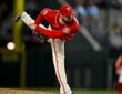 Texas Rangers pitcher Jordan Montgomery follows through off the mound with his back leg kicked high.