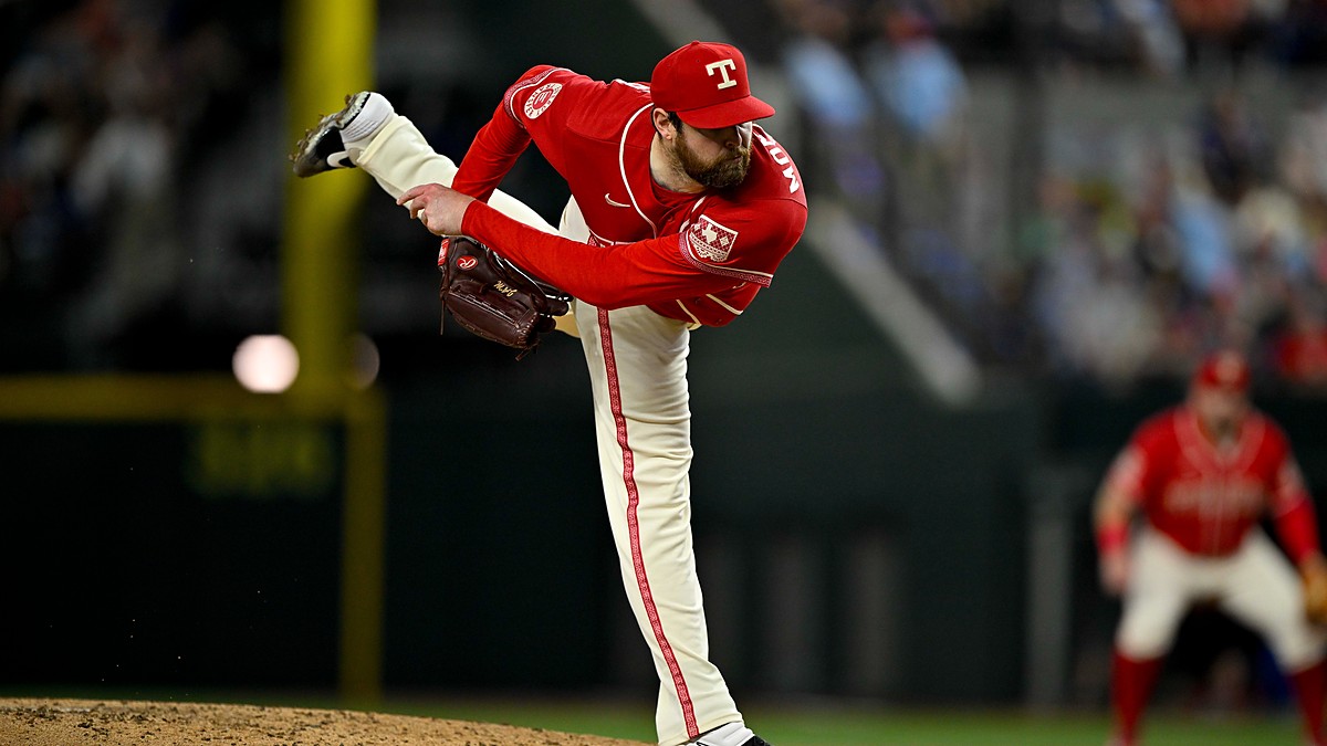 Texas Rangers pitcher Jordan Montgomery follows through off the mound with his back leg kicked high.