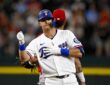 Texas Rangers third baseman Josh Jung pumps a fist at second base after hitting a double against the Angels.