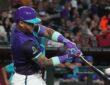 Arizona Diamondbacks second baseman Ketel Marte drives through his swing as the ball comes off the bat.