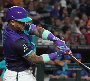 Arizona Diamondbacks second baseman Ketel Marte drives through his swing as the ball comes off the bat.