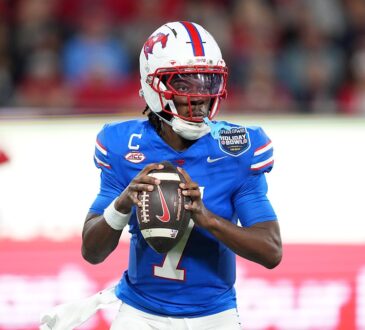 SMU Mustangs quarterback Kevin Jennings, No. 7, sets to throw with both hands on the ball.