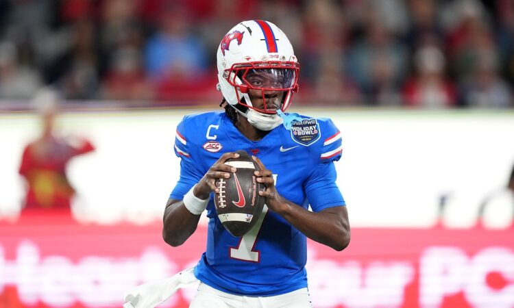 SMU Mustangs quarterback Kevin Jennings, No. 7, sets to throw with both hands on the ball.