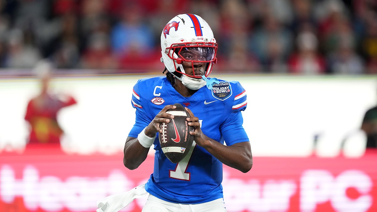SMU Mustangs quarterback Kevin Jennings, No. 7, sets to throw with both hands on the ball.