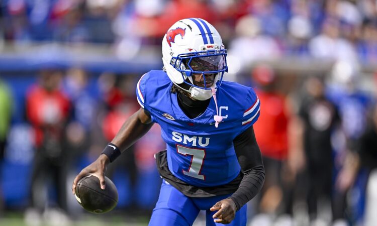 SMU Mustangs quarterback Kevin Jennings, No. 7, carries the ball in his right hand while running.