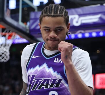 Utah Jazz guard Keyonte George raises a clenched fist as he reacts during a game against the Nets.