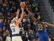 Dallas Mavericks guard Klay Thompson #31 shoots against Golden State Warriors forward Andrew Wiggins #22 at Chase Center.