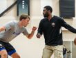 Dallas Mavericks guard Kyrie Irving dribbles to his left as forward Cooper Flagg defends during a workout.
