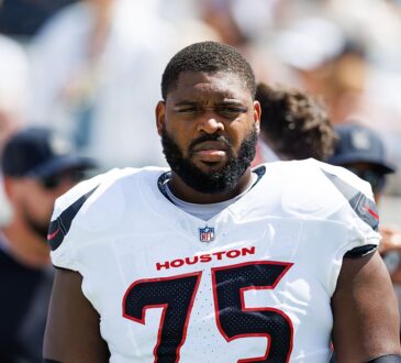 Houston Texans guard Laken Tomlinson stands on the field in uniform before a game against the Jaguars.