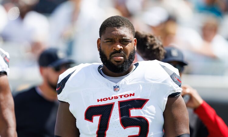 Houston Texans guard Laken Tomlinson stands on the field in uniform before a game against the Jaguars.