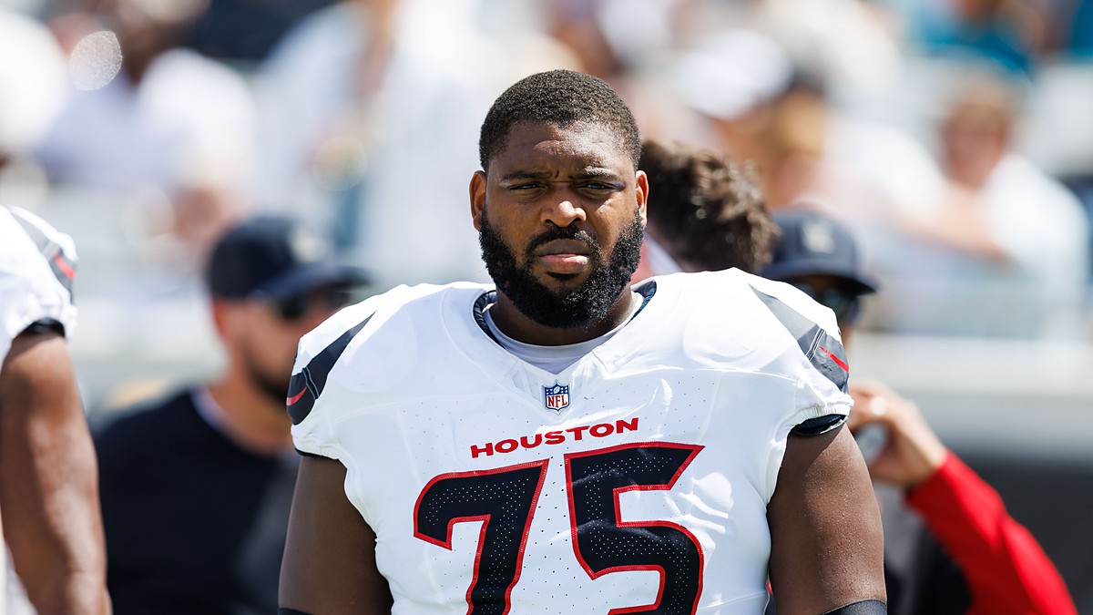 Houston Texans guard Laken Tomlinson stands on the field in uniform before a game against the Jaguars.