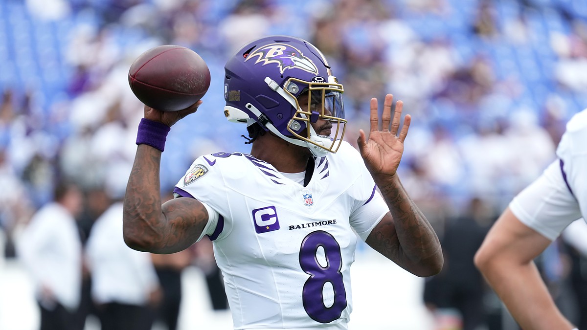 Baltimore Ravens quarterback Lamar Jackson cocks the ball back to throw during pregame warmups.