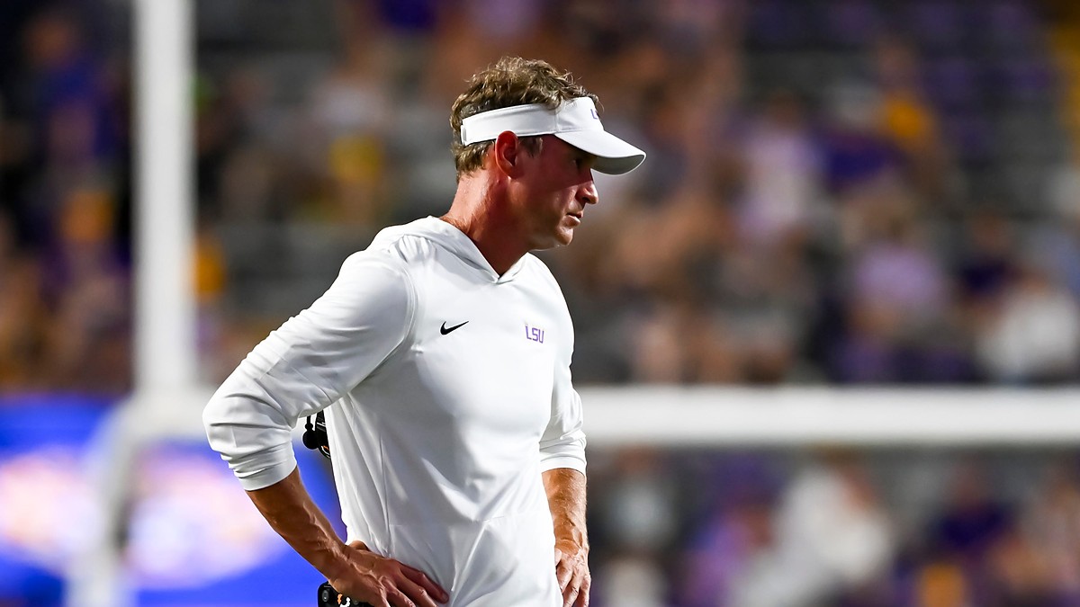 LSU head coach Lane Kiffin stands with his hands on his hips on the sideline during a game against Clemson.