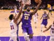 Los Angeles Lakers forward LeBron James #23 drives past Philadelphia 76ers center Joel Embiid #21 at Crypto.com Arena.