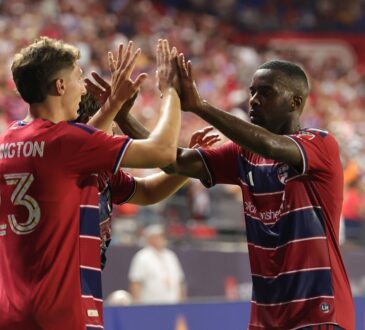 FC Dallas striker Logan Farrington high fives teammate Shaquell Moore after scoring against the Portland Timbers.