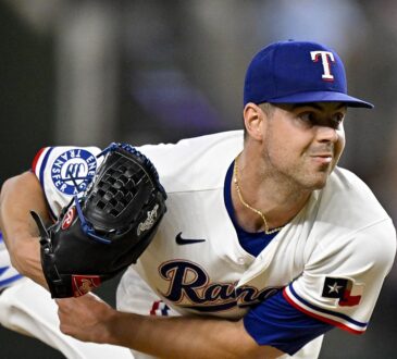 Texas Rangers starting pitcher MacKenzie Gore follows through with his glove hand extended after releasing a pitch.