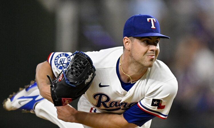 Texas Rangers starting pitcher MacKenzie Gore follows through with his glove hand extended after releasing a pitch.