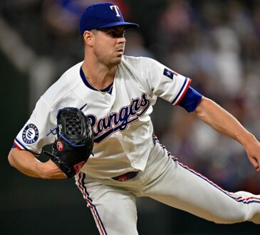 Texas Rangers starting pitcher MacKenzie Gore follows through on a pitch with his back leg kicked out behind him.