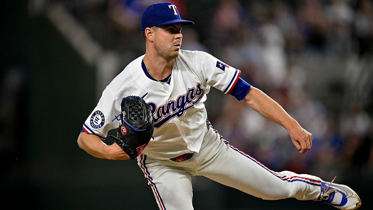 Texas Rangers starting pitcher MacKenzie Gore follows through on a pitch with his back leg kicked out behind him.