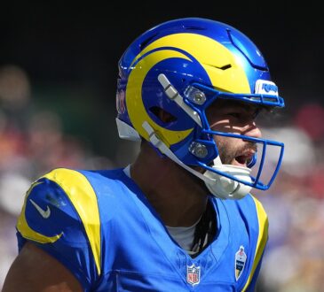 Los Angeles Rams wide receiver Makea Nacua shouts through his face mask after making a catch.