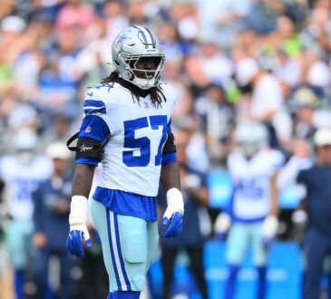Dallas Cowboys linebacker Malachi Lawrence stands on the field in his helmet and uniform during a game against Seattle.