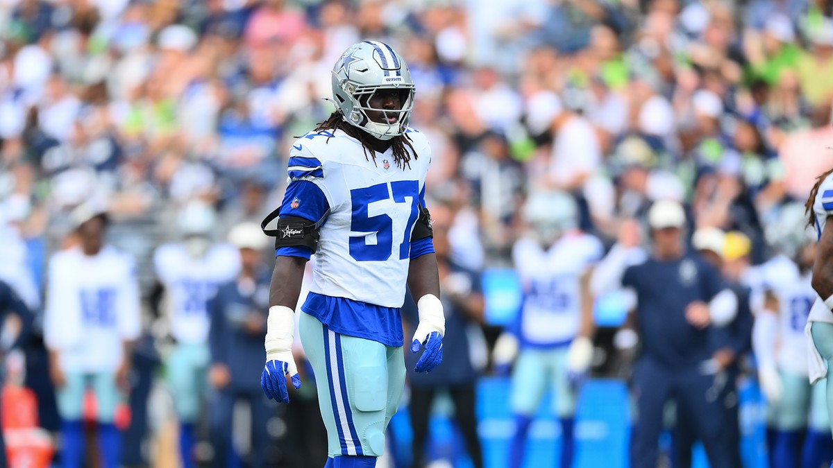 Dallas Cowboys linebacker Malachi Lawrence stands on the field in his helmet and uniform during a game against Seattle.