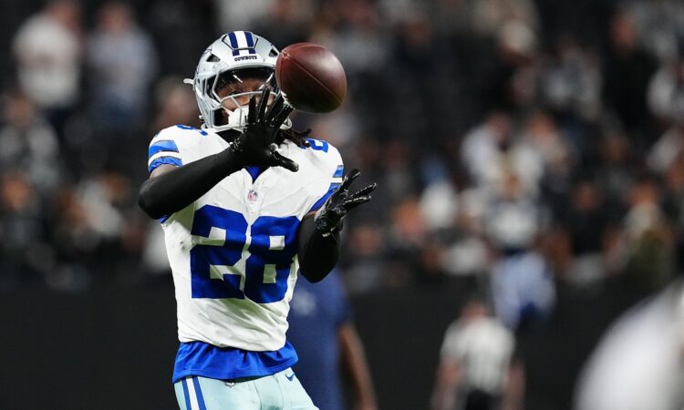 Dallas Cowboys safety Malik Hooker catches a ball during pregame warmups at Allegiant Stadium.