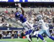 New York Giants wide receiver Malik Nabers catches a touchdown pass over Dallas Cowboys cornerback Trevon Diggs in the end zone.