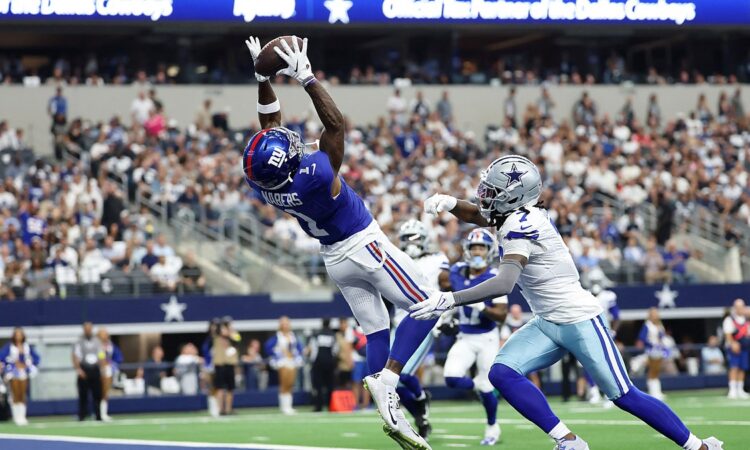 New York Giants wide receiver Malik Nabers catches a touchdown pass over Dallas Cowboys cornerback Trevon Diggs in the end zone.
