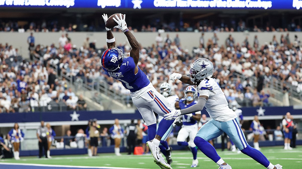 New York Giants wide receiver Malik Nabers catches a touchdown pass over Dallas Cowboys cornerback Trevon Diggs in the end zone.