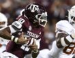 Texas A&M Aggies quarterback Marcel Reed tucks the ball and runs against the Texas Longhorns at Kyle Field.