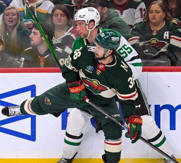 Minnesota Wild forward Mats Zuccarello and Dallas Stars defenseman Thomas Harley collide along the boards.