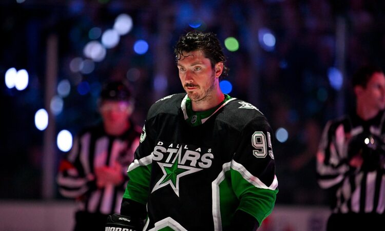 Stars center Matt Duchene stands on the ice under arena lights before puck drop against the Wild.