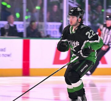 Dallas Stars center Mavrik Bourque, No. 22, skates with his stick out before a playoff game.