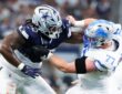 Dallas Cowboys defensive tackle Mazi Smith locks up with Detroit Lions center Frank Ragnow at AT&T Stadium.