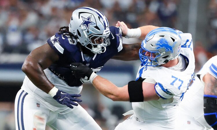 Dallas Cowboys defensive tackle Mazi Smith locks up with Detroit Lions center Frank Ragnow at AT&T Stadium.