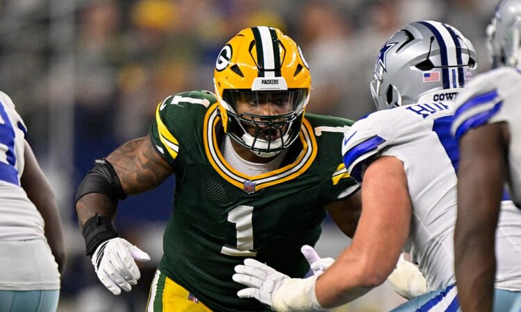 Green Bay Packers defensive end Micah Parsons comes off the line against a Dallas Cowboys blocker.