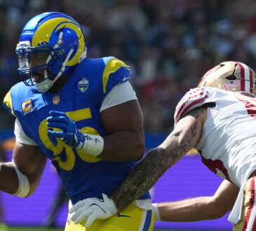 Los Angeles Rams defensive end Myles Garrett rushes off the edge as a San Francisco 49ers lineman reaches to block him.