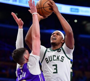 Milwaukee Bucks center Myles Turner rises to shoot over Los Angeles Lakers forward Jake LaRavia.