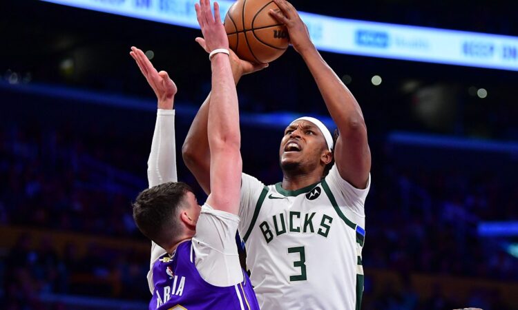 Milwaukee Bucks center Myles Turner rises to shoot over Los Angeles Lakers forward Jake LaRavia.
