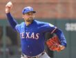 Texas Rangers right-hander Nathan Eovaldi, No. 17, brings his arm forward to deliver a pitch.