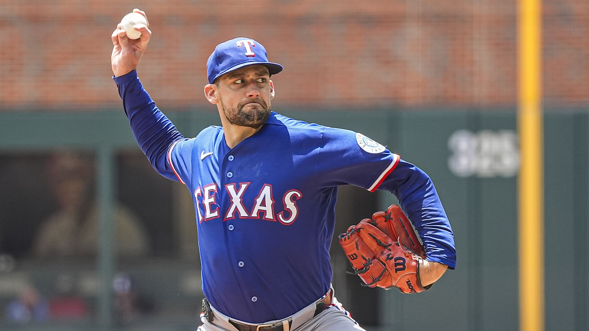 Texas Rangers right-hander Nathan Eovaldi, No. 17, brings his arm forward to deliver a pitch.