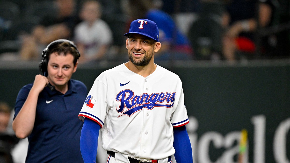 Texas Rangers pitcher Nathan Eovaldi smiles as he walks onto the field before a game against Boston.