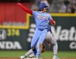 Texas Rangers infielder Nicky Lopez thrusts a fist toward the dugout after reaching second base against the Rays.