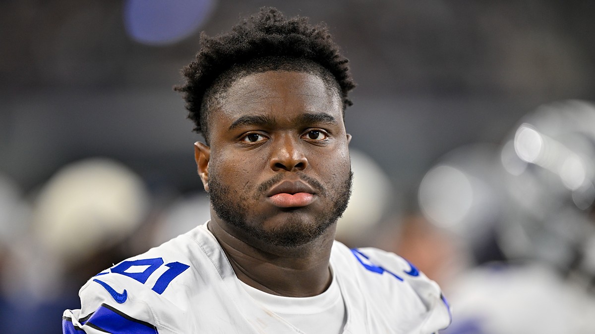 Dallas Cowboys defensive tackle Otito Ogbonnia looks toward the field from the sideline during a game against the Saints.