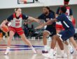 Dallas Wings guard Paige Bueckers dribbles against defenders during a Team USA practice.