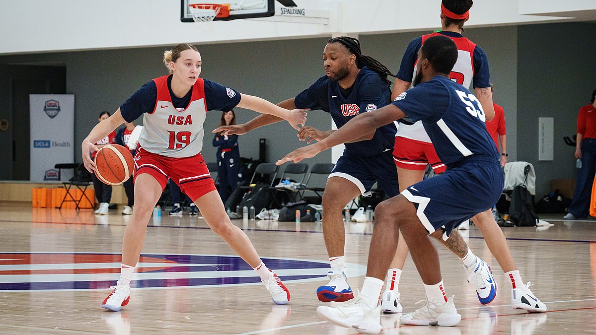 Dallas Wings guard Paige Bueckers dribbles against defenders during a Team USA practice.