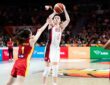 United States guard Paige Bueckers, No. 4, rises for a jump shot over a China defender.