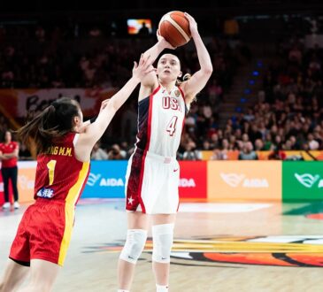 United States guard Paige Bueckers, No. 4, rises for a jump shot over a China defender.